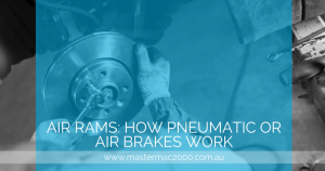 mechanic changes car brakes